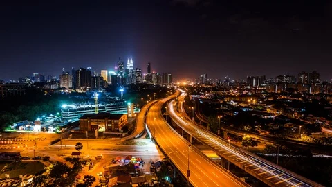 Kuala Lumpur downtown served by elevated highways &amp; metro line time lapse at nig Stock Footage 118852573