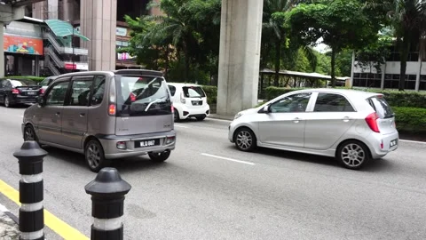Kuala Lumpur heavy traffic pack with cars during rush hour near Monorel Station Stock Footage 133849600