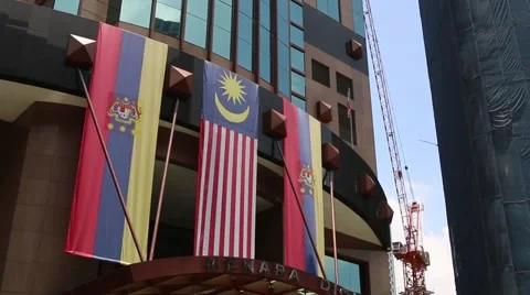 Kuala Lumpur Skyscraper with flags Stock Footage 47991039