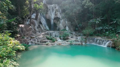 Kuang Si waterfall in Laos, is surrounded by trees and a turquois pond. Stock Footage 305154443