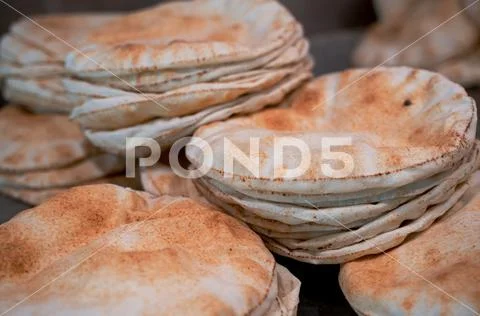 Kuboos or khubz - fresh pita bread togeather in a table ~ Hi Res #136034493