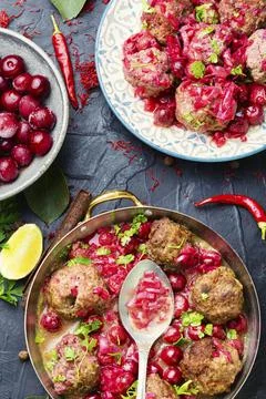 Kufta in cherry sauce Stock Photos