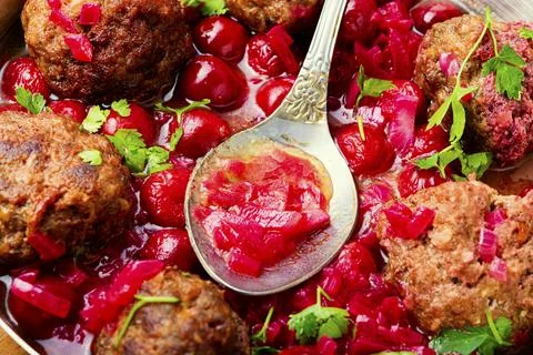 Kufta in cherry sauce Stock Photos