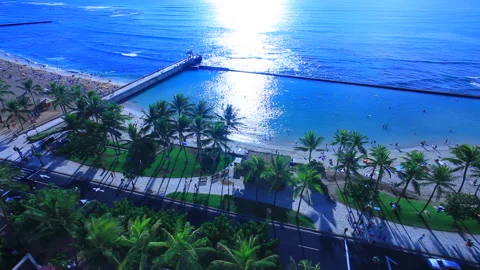 Kuhio Beach, the Breakwater, and the Rays of Sunshine Stock Footage 330215007