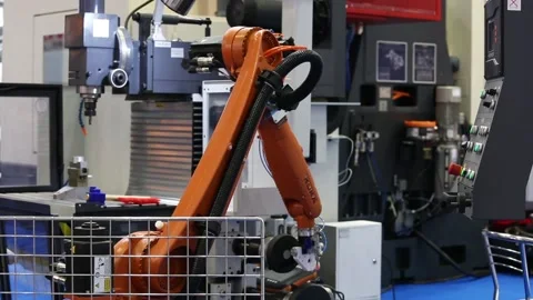 Kuka robot arm pushing the buttons on control panel of CNC machine 库存影片 90104493