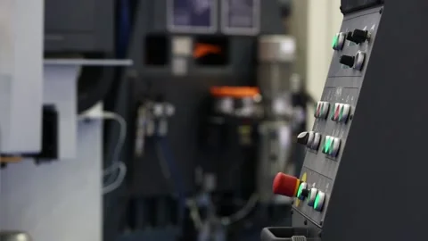 Kuka robot arm pushing the buttons on control panel of CNC machine 库存影片 90749991