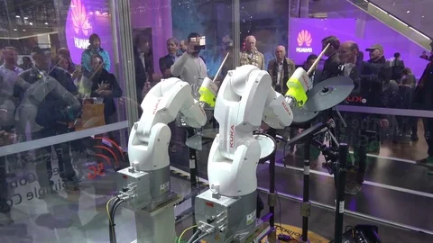 KUKA robot hands playing drums on exhibition fair Cebit 2017 in Hannover Messe Stock Footage 74110132