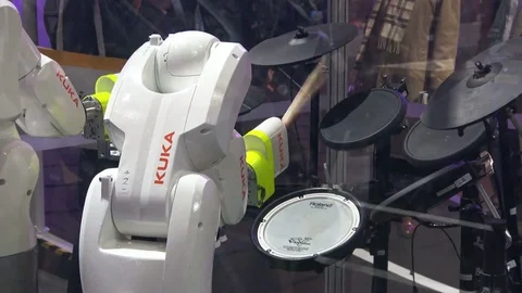 KUKA robot hands playing drums on exhibition fair Cebit 2017 in Hannover Messe Stock Footage 80991856