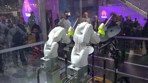 KUKA robot hands playing drums on exhibition fair Cebit 2017 in Hannover Messe Stock Footage 82668997