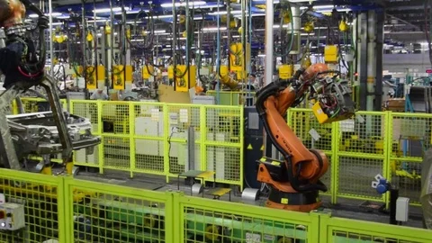 Kuka robots weld car on conveyor line of factory AutoVAZ Stock Footage 73477989