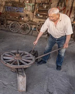 Kula Manisa Turkey Master Blacksmith Working on Wooden Carriage Wheel Stock Photos