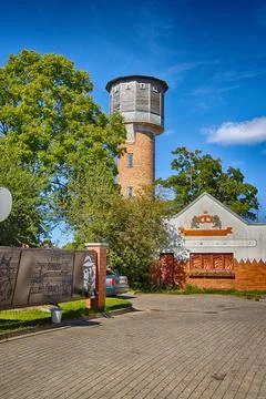 Kuldiga. A water tower is an elevated structure that supports a water tank. Stock Photos