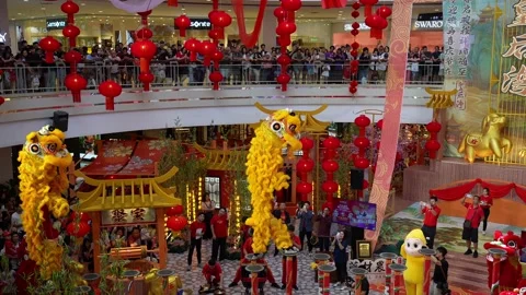 Kun Seng Keng lion dance performance at Queensbay Mall atrium Stock Footage 332738816