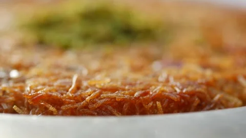 Kunafa with a wipe cream on a plate . Stock Footage 273128597