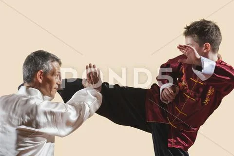 Kung Fu, Changquan, Duilian, Long Fist Style, Kung Fu instructor and boy (10-11) Stock Photos