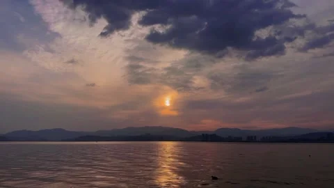 Kunming Dian Lake sunset over city skyline and mountains Stock-Footage 333552903