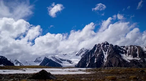Kurai steppe and North Chuya ridge at the dawn. Clouds and Mountains Stock Footage 66483131