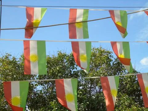 Kurdish flags flutter in the wind at a park in Erbil, Iraq 写真素材