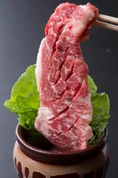 Kuroge beef Meat large format with lettuce over stew Stock Photos