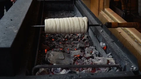 Kurtos Kalacs or Trdelník. Sweet Pastry Food rolls. Stock Footage