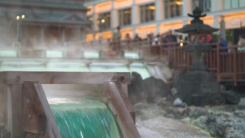 Kusatsu Onsen spring in town square at sunset showing the final water chute  Stock Footage 101508624