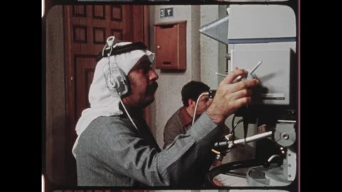 Kuwait 1970s: Parrot puppet on TV set. Camera operator. Director talks to actors Stock Footage 324571947
