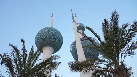 Kuwait  tower low angle shot with dates tree Stock Footage 295482634