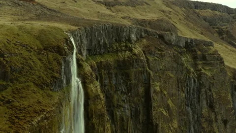 Kvernufoss waterfall descending over basalt cliffs in Kvernugil canyon near 스톡 동영상 345070199