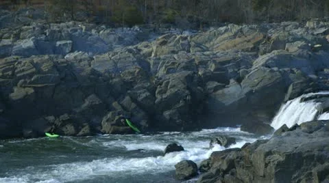 Kyakers pulling out of the rapids Video stock 12706514