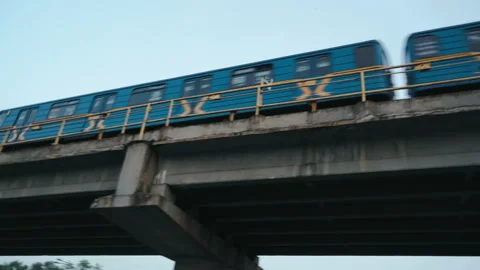 Kyiv Metro Train passing over bridge during sunset time Stock Footage 141114640