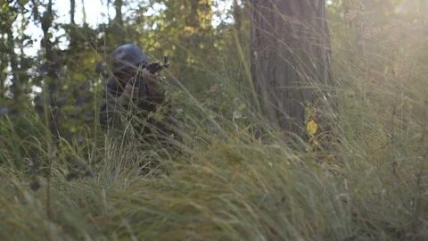 Kyiv/ Ukraine - 24/08/2019 / Armed soldier scout in forrest for enemies Stock Footage