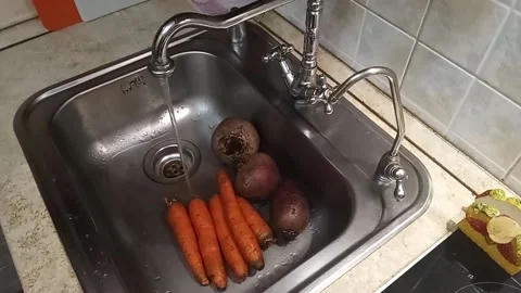 Kyiv. Washing raw vegetables Stock Footage 225122851