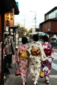 KYOTO, JAPAN – 03/19/2020: 3 Women in kimono walking Stock Photos