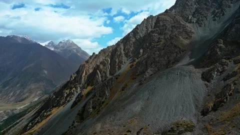 Kyrgyzstan mountains, remote summit, harsh rugged terrain, aerial view Stock Footage 311113862