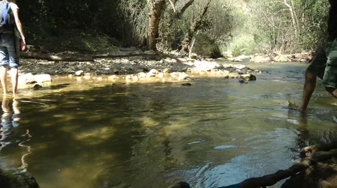 Kziv river at spring. People walking across the spring. Stock Footage 2601057