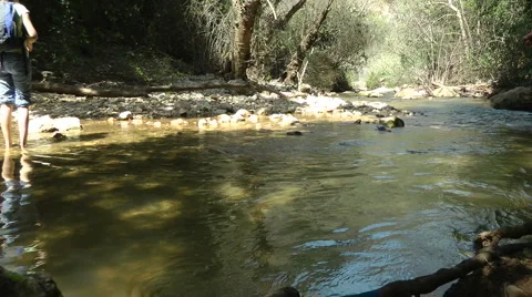 Kziv river at spring. Slow motion. People walking across the spring. Stock Footage 2604169