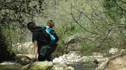 Kziv river at spring. Slow motion. People walking across the spring. Stock Footage 2608178