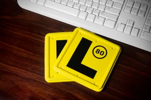 L plates and a keyboard Stock Photos