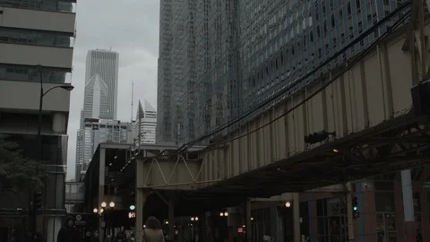 L Train passes over city street in Chicago Stock Footage 93708879