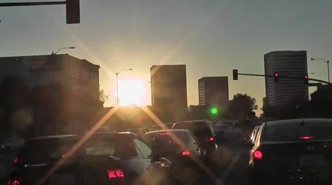 LA-0004 TIMELAPSE DRIVING IN TRAFFIC @ SUNSET Stock Footage 10699287