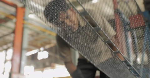 LA and Shallow Focus Shot of Worker Examining Battery Lead Plates (4K) Stock Footage 60762469