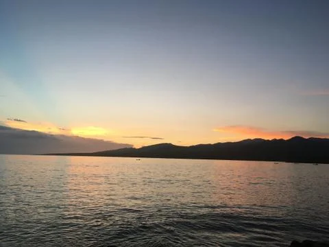 La Boca, Cuba, 2017, view of the sea surrounded by mountains at sunset Stock-Fotos