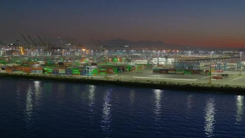 LA, CA, USA - September 21, 2026: Port of Los Angeles cargo terminal at dusk Stock Footage 346108457