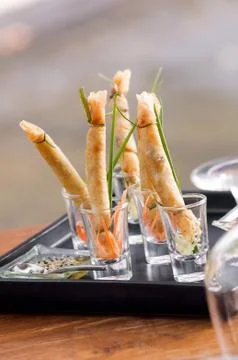 A la carte designed crispy deep-fried spring roll in mini glas Stock Photos