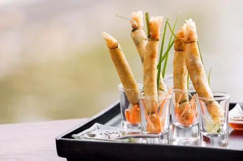 A la carte designed crispy deep-fried spring roll in mini glas Stock Photos