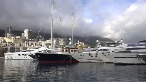 La Condamine, Monaco - July 4, 2025: Row of sleek luxury yachts, docked in Port Stock Footage 314969164