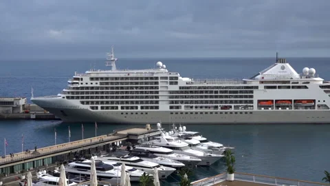 La Condamine, Monaco - July 4, 2025: Side view of a large cruise ship docked in Stock Footage 314969685