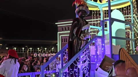 La Coruna, Spain - 5 Jan 2023: Feast of the Three Kings. King Baltasar throws Stock Footage 229503731