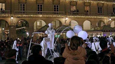 La Coruna, Spain - 5 Jan 2023: Feast of the Three Kings. Men in white festive Stock Footage 229504034
