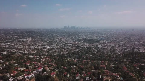 LA: Drone shot over Griffith Park looking out towards the Downtown skyline Stock Footage 154226746